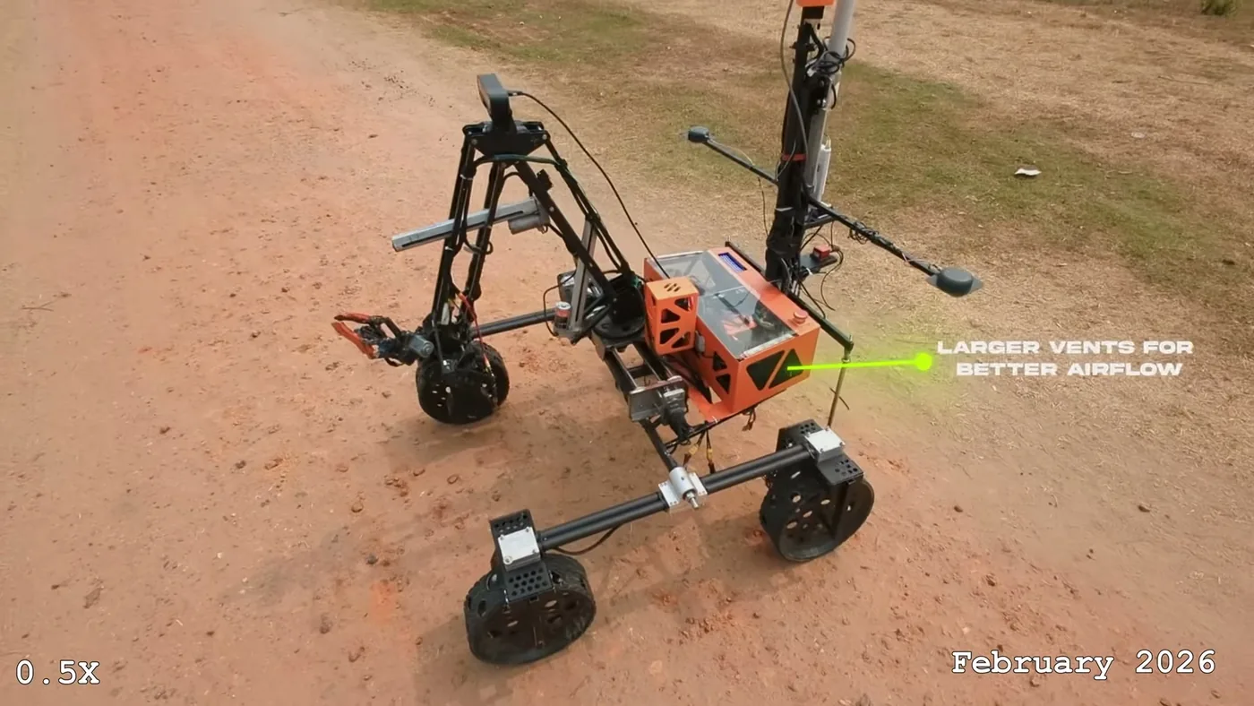 Taurus on test terrain in 2026, with 12-inch slotted wheels and an orange electronics enclosure