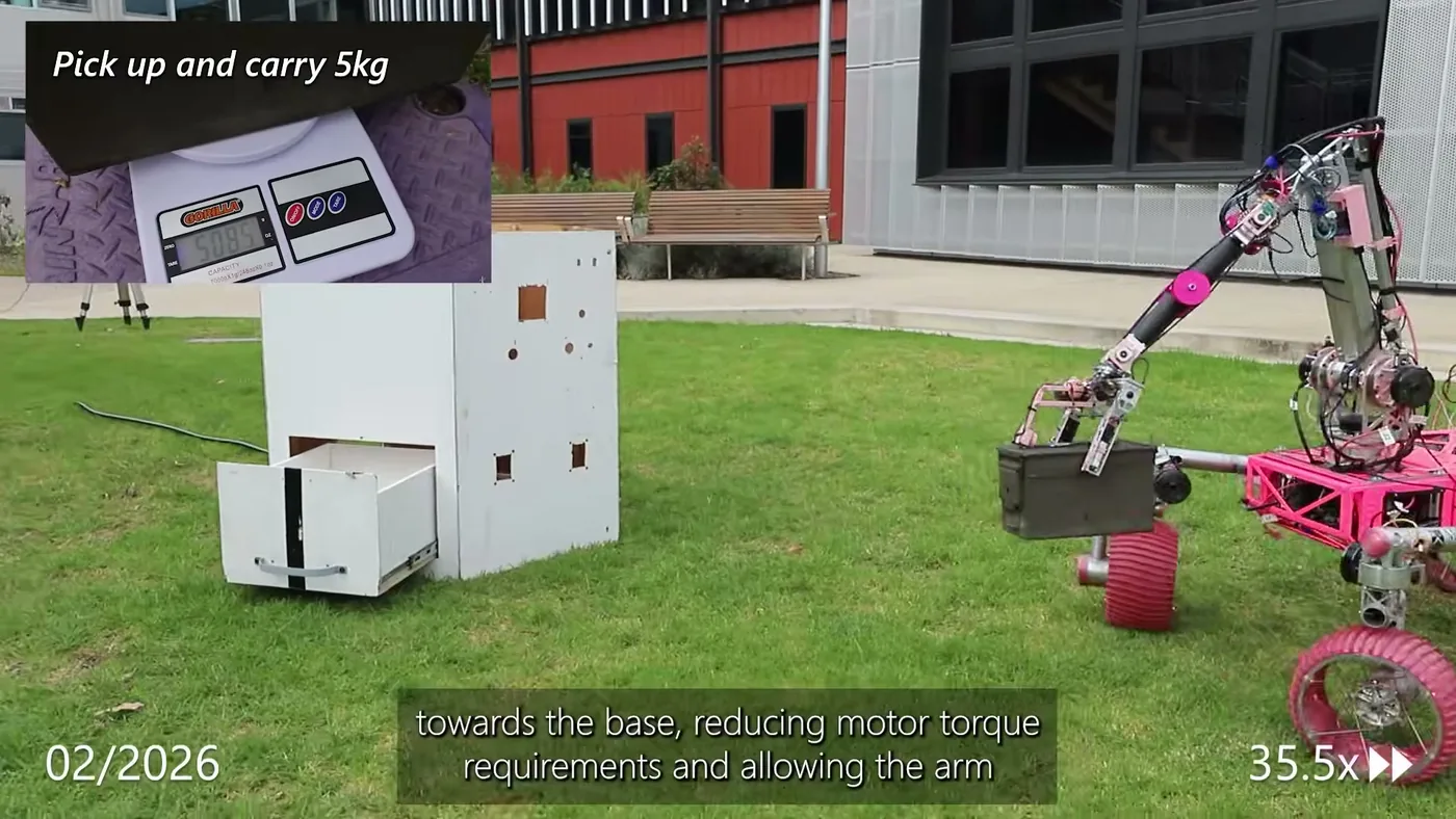 Monash lifting a 5.085 kg cache out of a mock lander drawer