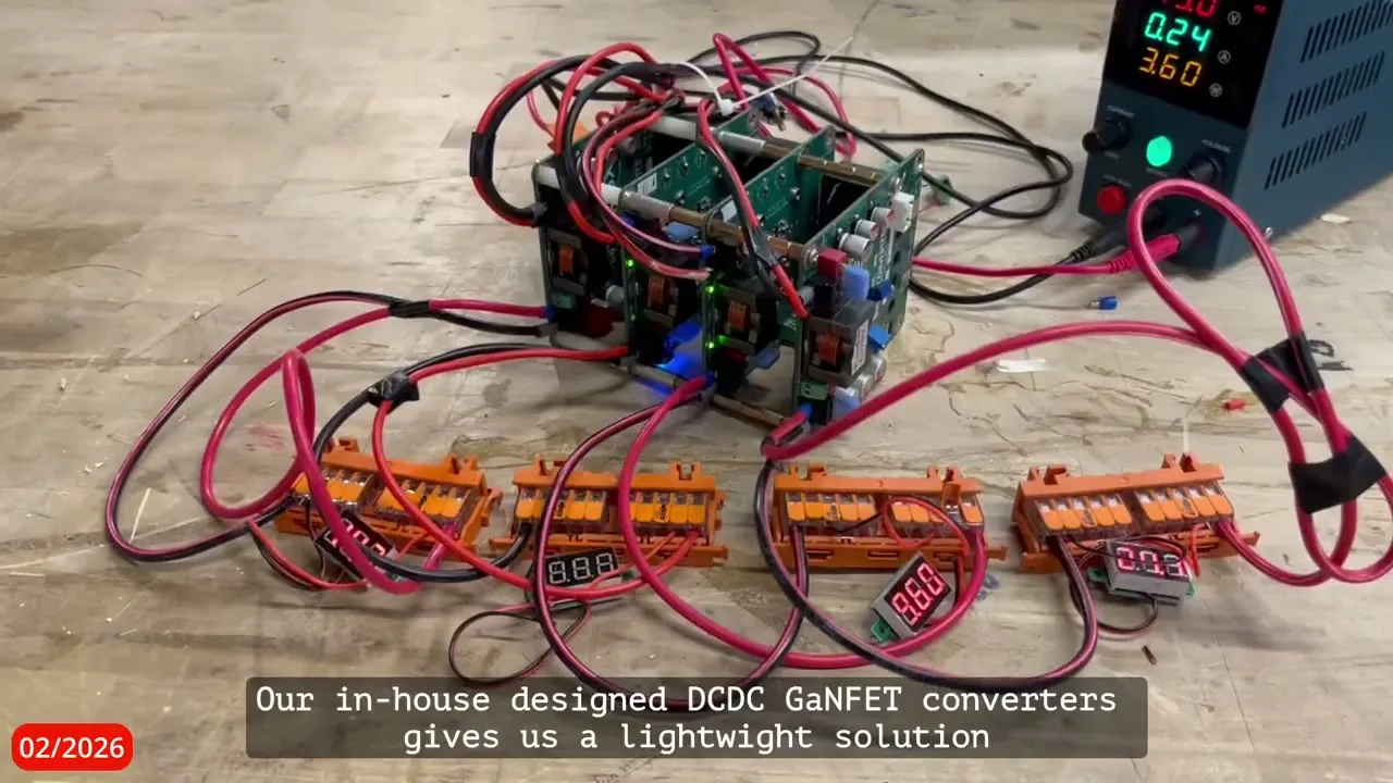 Stacked in-house converter boards connected to a bench power supply