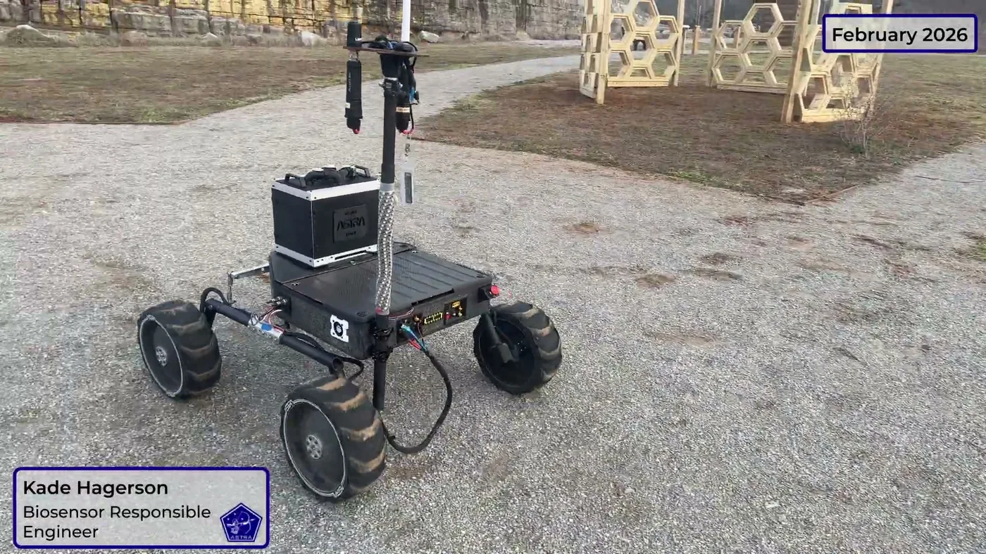 The 2026 ASTRA core rover on gravel, with four printed wheels and a camera mast