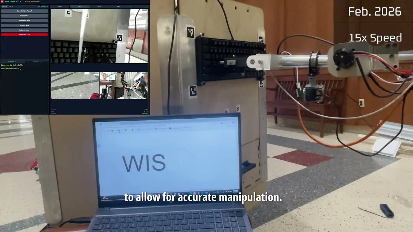 The 2026 arm typing on a mock panel